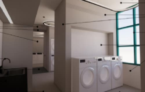 A room with three white front-loading washing machines beside a large window, a dark sink area on the left, and hallways leading deeper into the modern, minimalistic SDSU housing space.