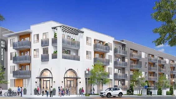 A modern four-story apartment building, 8181 Allison Apartments in La Mesa, features balconies and large windows. People walk on the sidewalk below, shaded by trees, all beneath a clear blue sky.